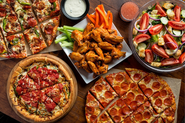 Unos 600px Pizza, wings and salad at Uno Pizzeria & Grill