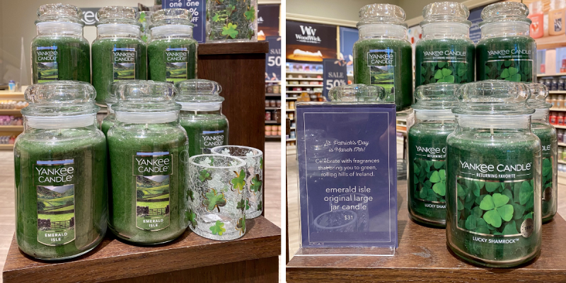 Green Candles and accessories on display at candle store inside shopping mall.